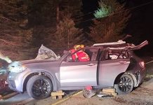Prohibited driver in uninsured BMW crashes into rock face flips on Millstream Road