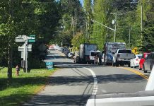 Two men taken to hospital after rollover crash blocks Sooke Road